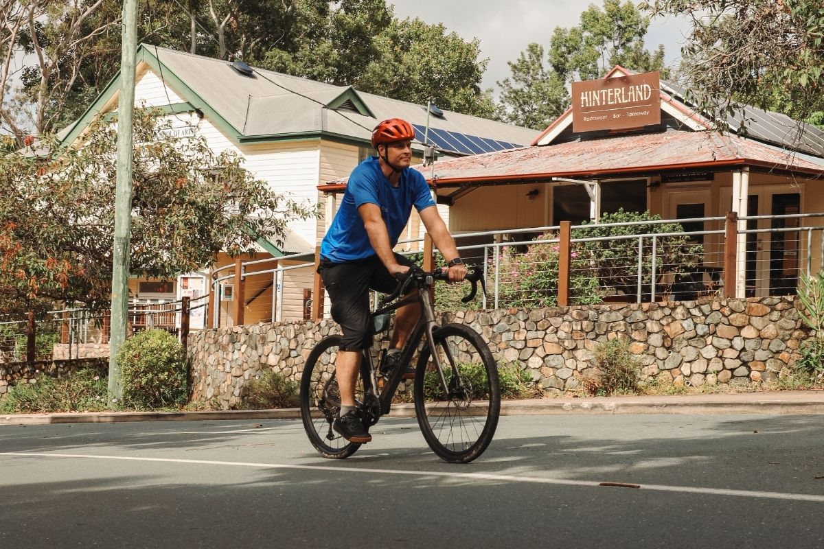 Cyclists riding through Pomona on a gravel bike