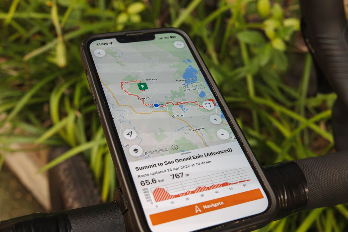 Cyclists riding using GPS route map Noosa gravel route