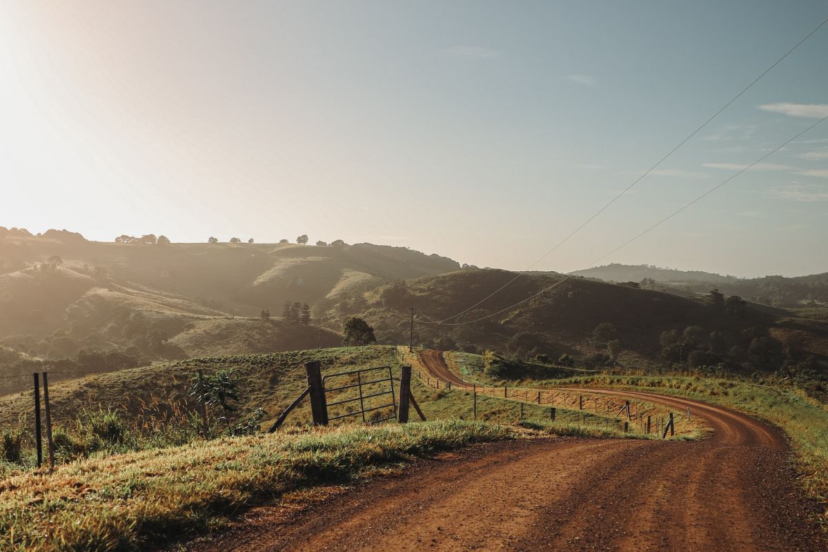 Stunning early morning view of gravel roads and rolling hills